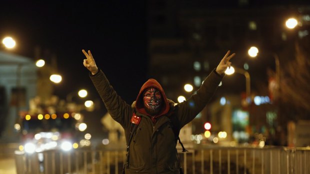 A protester demonstrates against police brutality after the Ferguson shooting of Michael Brown.