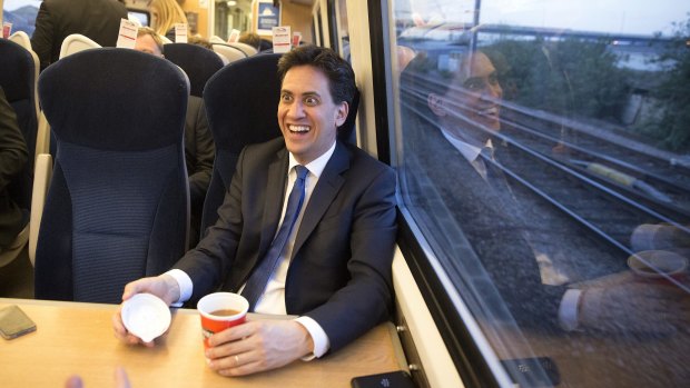 On the campaign trail: Labour Party leader Ed Miliband speaks to the media on a train from Leeds to London after speaking at an election rally.