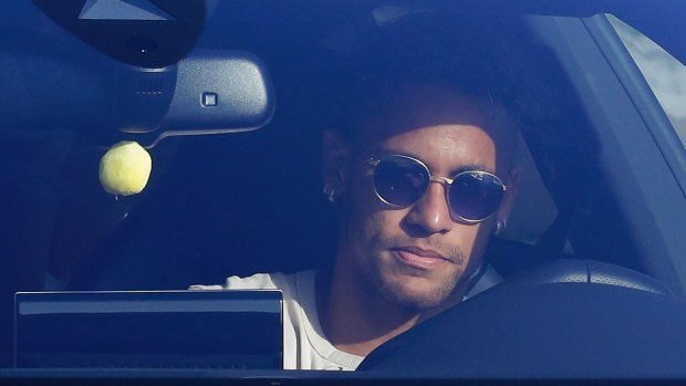 Brazil striker Neymar arrives at Barcelona's training grounds on Wednesday.