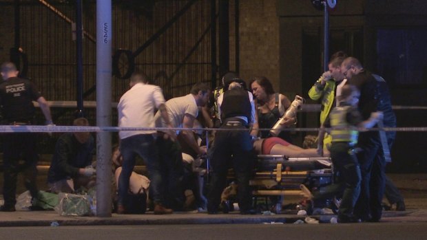 Paramedics treat the injured on Thrale Street. 