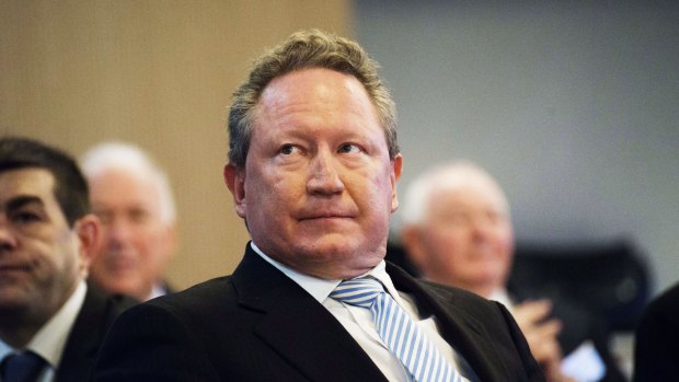 The price of iron ore is being smashed and despite his best efforts, the value of Andrew Forrest's shares in his Fortescue Metals Group is taking a beating as well.