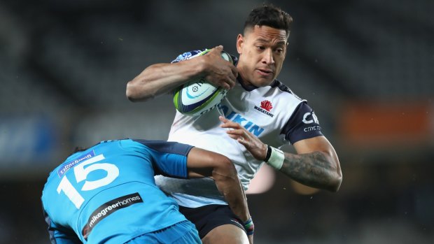 Down on form: Israel Folau is tackled by Melani Nanai during the round 17 Super Rugby match between the Blues and the Waratahs at Eden Park.