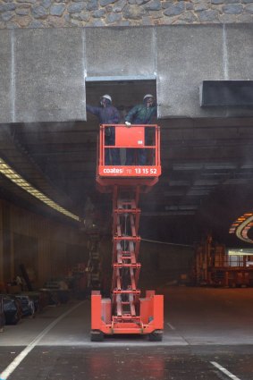 Cleaning in the Parkes Way tunnel to ensure no asbestos contamination.