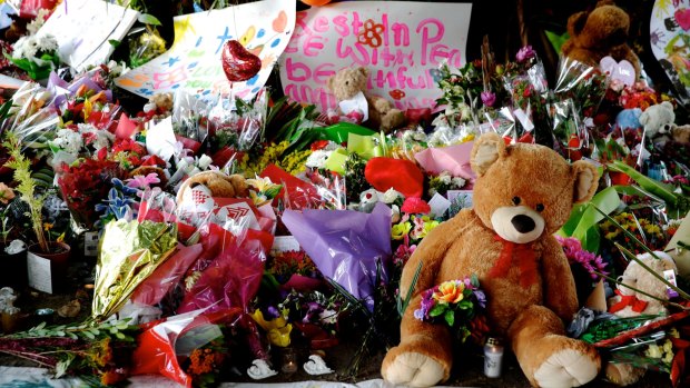 Teddy bears and flowers left for the eight children killed in a Cairns home.