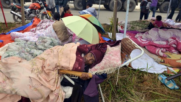 Outdoor respite: Residents rest outdoor in the aftermath of an earthquake in the town of Yongping in south-west China's Yunnan province.