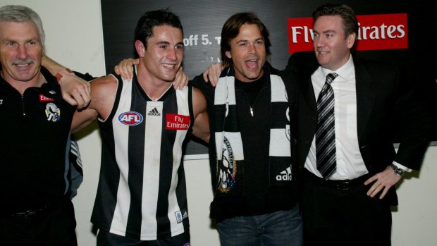 Actor Rob Lowe and Collingwood president Eddie McGuire sing the song with coach Mick Malthouse and Paul Licuria in 2003. 