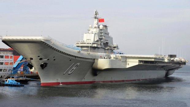 China's aircraft carrier, the Soviet-built Liaoning, berthed in a port of China.