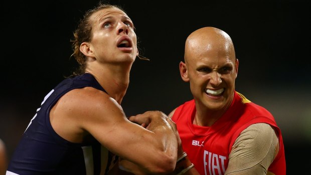 Nathan Fyfe of the Dockers and Gary Ablett of the Suns tussle for possession.