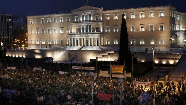Protesters gather for an anti-austerity, pro-government demonstration outside the Greek parliament in Athens.