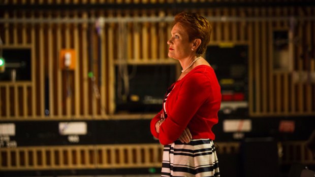 One Nation leader Pauline Hanson on the set of <i>Insiders</i>, watching host Barrie Cassidy.