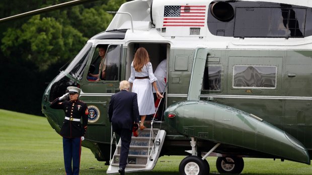 US President Donald Trump, First Lady Melania Trump, and their son, Barron Trump, board Marine One at the White House.