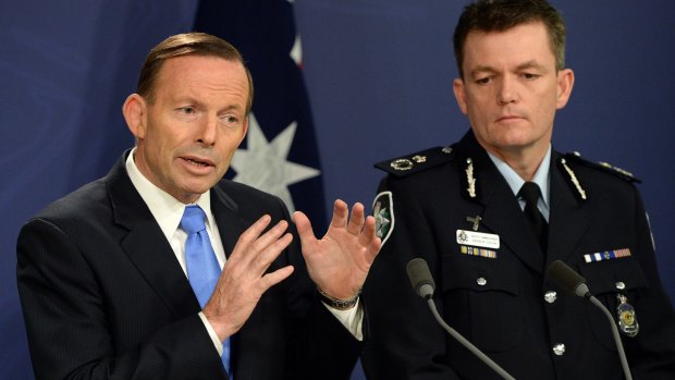 Prime Minister stands firm: Tony Abbott speaks at a joint press conference with Australian Federal Police Commissioner Andrew Colvin.