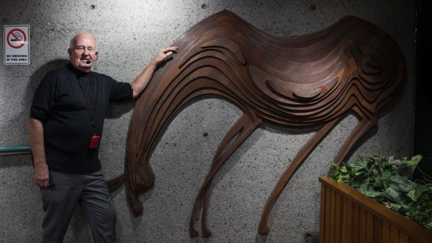 Architect Tao Gofers with the animal sculpture, designed by Penny Rosier, which greets visitors in the foyer.