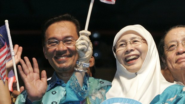 Malaysian opposition leader Anwar Ibrahim, now jailed, with his wife Wan Azizah at a rally at in Petaling Jaya, Malaysia, in 2008.  