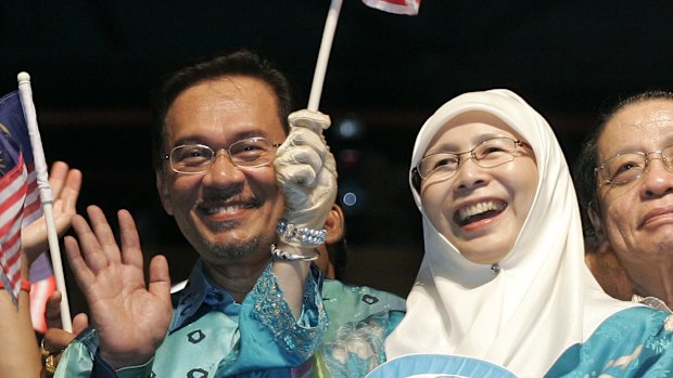 Malaysian opposition leader Anwar Ibrahim, now jailed, with his wife Wan Azizah at a rally at in Petaling Jaya, Malaysia, in 2008.  