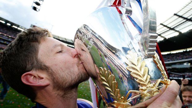 Matthew Boyd kisses the premiership cup.