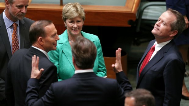 Political leaders greet British PM David Cameron in the House of Representatives after his address.
