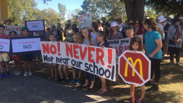 Protesters gathered in Guildford to protest against a proposed McDonald's.