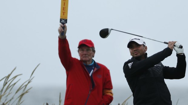 quiet, please: Jason Day tees off at the second hole.