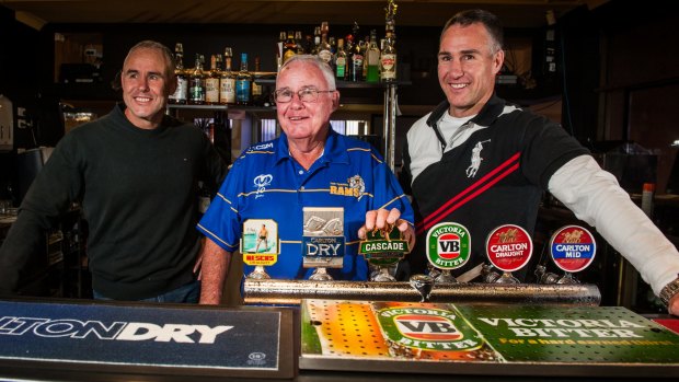 Woden Ram's long time member, Peter Cox (centre) wih sons Geoff, who coached the last first-grade premiership team in 1996, and David, who played NRL, as they celebrate the club's 50th anniversary reunion week.