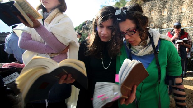 Members of Women of the Wall pray at the Western Wall wearing prayer shawls and phylacteries or prayer boxes, both of which Orthodox Judaism regards as solely for men.