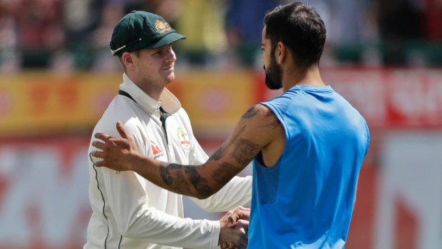 Steve Smith shakes hands with Indian counterpart Virat Kohli after the conclusion of the fourth and final Test on Tuesday.