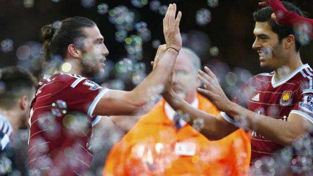 West Ham's Andy Carroll celebrates his second goal at home against Swansea on Sunday. 