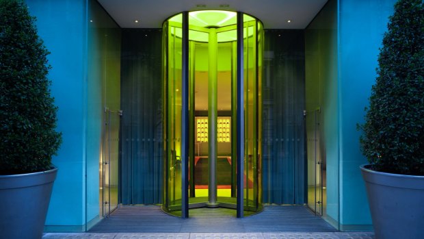 The yellow glass revolving doors of St Martins Lane, London. 