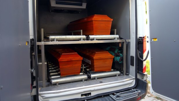 The coffins of mother Rehan Kurdi, and Syrian boys Aylan, 3, and Galip, 5, are placed in a funeral vehicle.