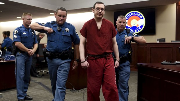 James Holmes leaves court to begin his 12 life sentences in jail. 