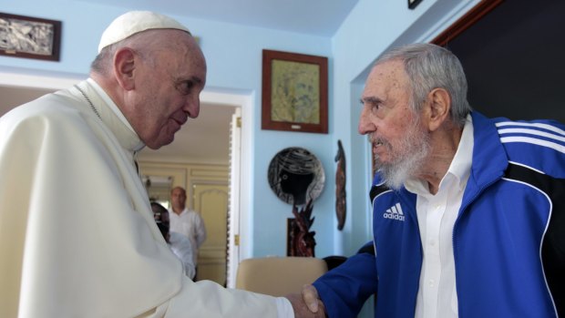 Breaking barriers ... Pope Francis shakes hands with Cuba's Fidel Castro in Havana on Sunday.