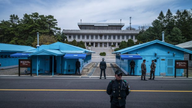 Soldiers stand guard outside the meeting rooms that straddle the border between North and South Korea in Paju along the Demilitarized Zone.