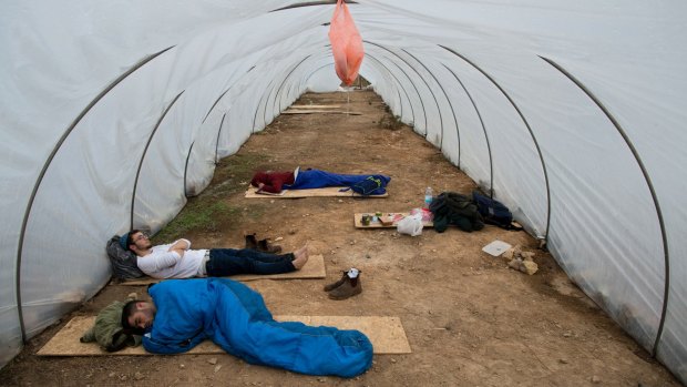 Jewish settlers sleep under plastic  at Amona, an outpost in the Israeli-occupied West Bank. Israel's Supreme Court has repeatedly called for the outpost's demolition, but the government has sought to postpone any action against the settlers.