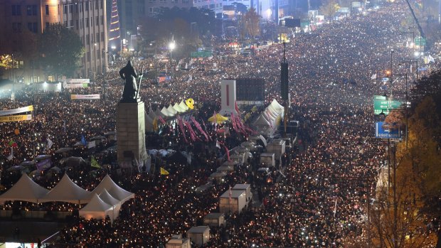 South Korean protesters stage a rally calling for South Korean President Park Geun-hye to step down in Seoul on Saturday.