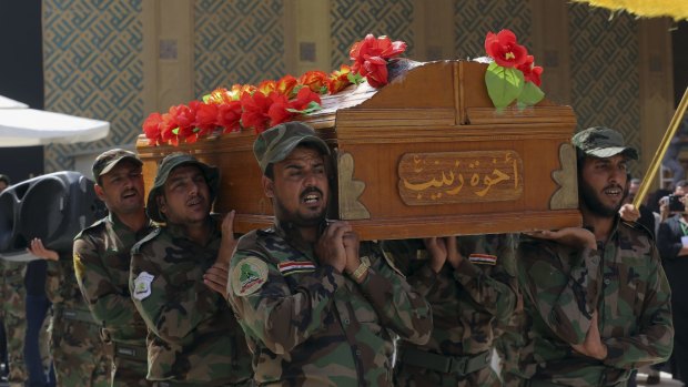 Members of the Shiite militia Asaib Ahl al-Haq carry the coffin of a fighter killed in clashes with Islamic State at a funeral in the Iraqi city of Najaf last week. 