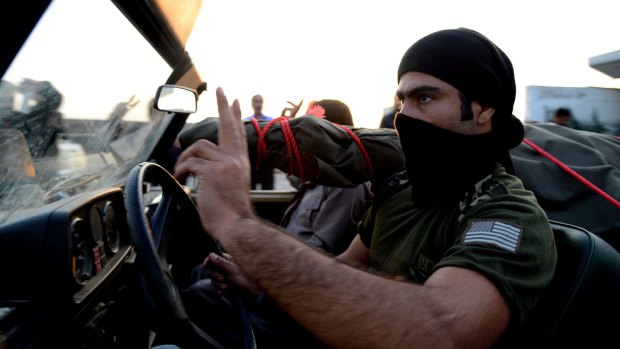 Slowing Islamic State's advance: A peshmerga fighter arrives at the Turkish-Iraqi border.