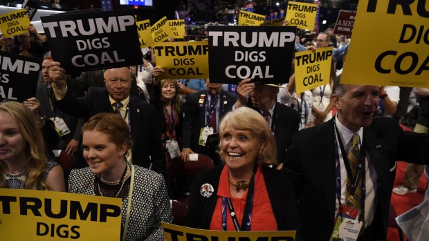 Delegates hold signs reading "Trump Digs Coal" during the Republican National Convention in Cleveland in July.