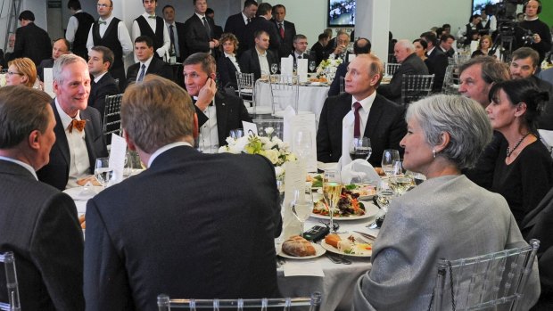 Briefly US national security advisor Michael Flynn sits next to Russian President Vladimir Putin at an event celebrating RT in Moscow. 