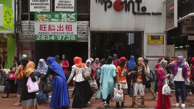 Indonesian domestic helpers on their day off in Causeway Bay, Hong Kong.