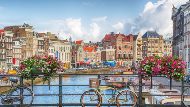 See Amsterdam by bike or boat.
