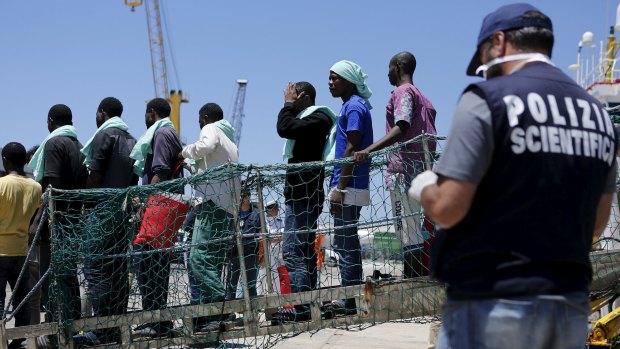 Migrants disembark from the Panamanian ship Dignity 1 in Pozzallo, Italy on Tuesday. Thousands of migrants fleeing war and poverty in Africa and the Middle East have died trying to cross the Mediterranean.