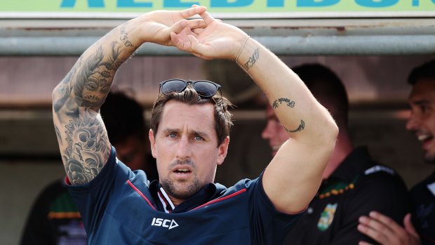 Rooster in the spotlight: Mitchell Pearce watches on during the round two NRL match between his Roosters and the Canberra Raiders in Canberra.