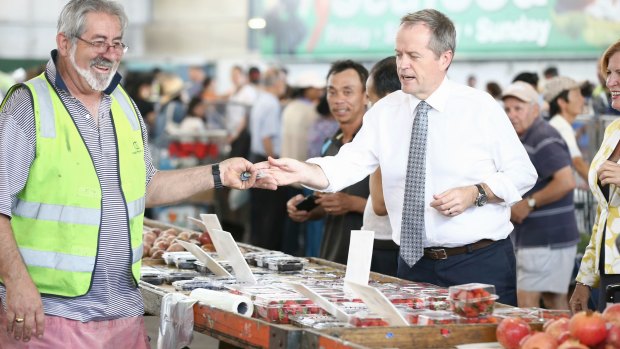 Opposition Leader Bill Shorten visits the Sydney Markets to discuss the GST, on Friday. 