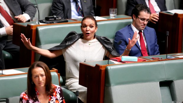 Labor MP Anne Aly reacts to an answer by Minister for Immigration and Border Protection Peter Dutton during Question Time at Parliament House.