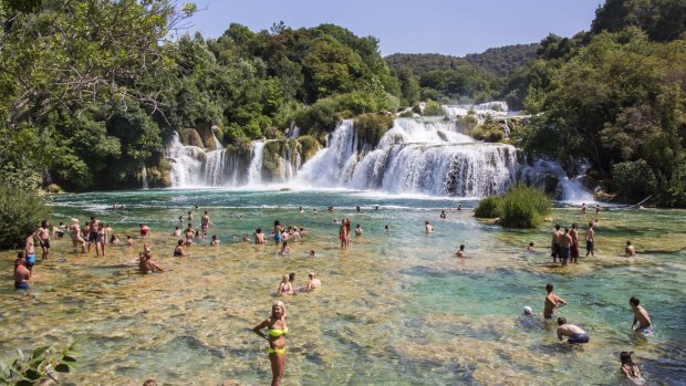 Tourists swim in the Krka National Park in Croatia. 
