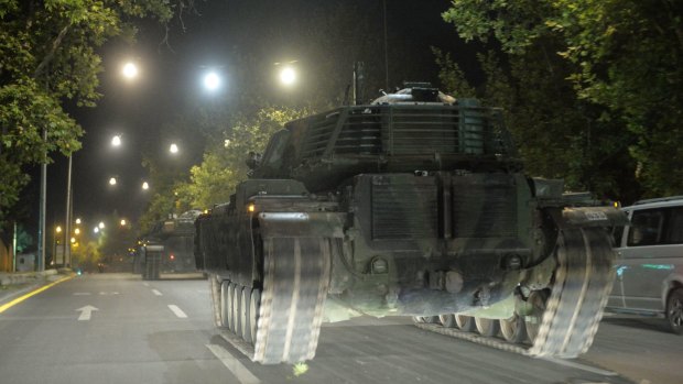 Turkish army tanks move in the main streets in the early morning hours of Saturday in Ankara, Turkey. 