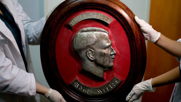 A relief portrait of Adolf Hitler was among the Nazi artifacts believed to have been taken to Argentina by fugitive Germans.