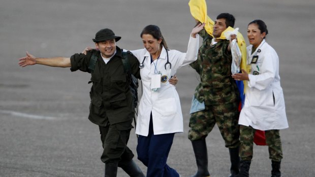 Soldiers and police officials held hostage by the FARC rebels at Villavicencio's airport after being freed in 2012.