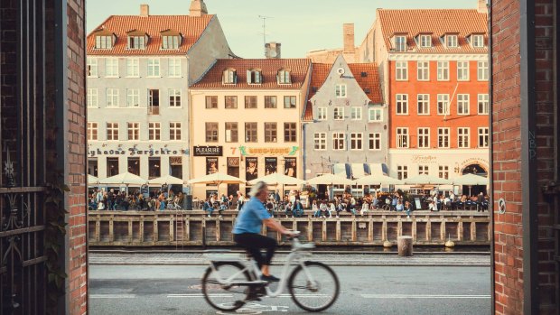 Nyhavn riverbank with historical houses and restaurants, Copenhagen.