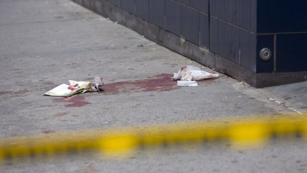 Aftermath: Blood is seen on the sidewalk near the 1 Oak nightclub in New York.